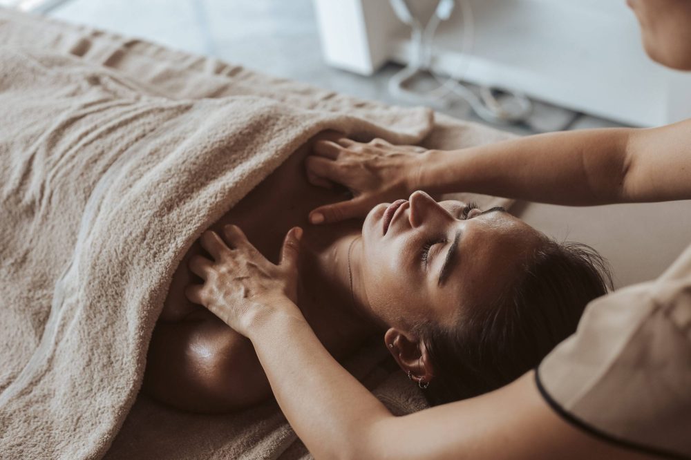 Woman having a facial massage at the spa